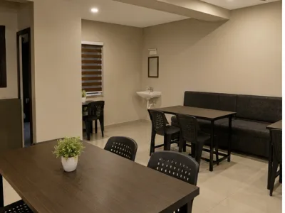Townleaf Budget Rooms — Living and dining area (fictional demo image)