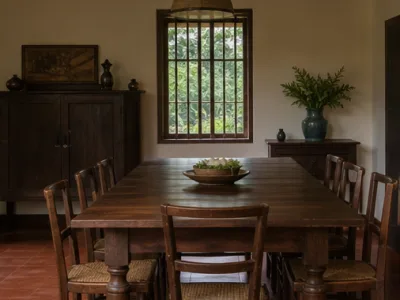 Silver Fern Plantation Stay — Living and dining area (fictional demo image)