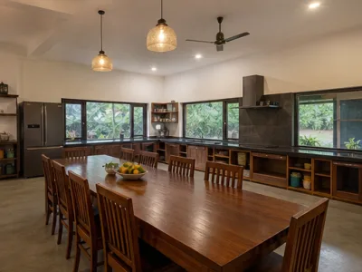 Banyan Courtyard Group Stay — Living and dining area (fictional demo image)